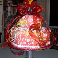 Birthday Cake - 30Th Two tiered birthday cake. Bottom tier petal pan, top tier round. Marbled Buttercream icing, red, orange & yellow.