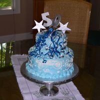 50Th Birthday Cake Two tier cake. Customer did not want any reference to "over the hill". Marbled blue & white buttercream. Silver accents -...