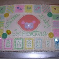 Dscn1428.jpg This was my first baby shower cake. It's a 1/2 sheet and was decorated wit with non-dairy whipped topping. The baby face is color flow...