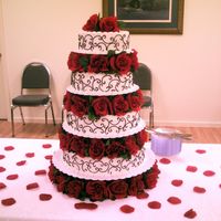 Bounteous Love 4 tier wedding cake. Bottom layer was white, 3rd layer was carrot, 2nd layer was red velvet and top layer was italian cream cake.