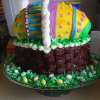 Easter Basket Cake The basket is 3 layers of yellow cake (9" I believe) decorated with canned chocolate frosting. The handle is MMF wrapped around a wire...
