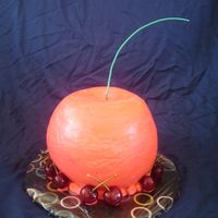 3D Cherry Cake CSM: I made this for a friend's birthday. He LOVES cherries. This was my first carved cake. I used 3" of 8" layers...