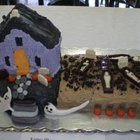 Graveyardscream Cakes are decorated with buttercream; ghost & steps are fondant; tombs & mummies made from chocolate mold; dirt is oreo cookies.