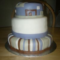 Lindsey's Baby Shower Cake Yellow and Chocolate cake w/buttercream filling covered in MMF. All decorations are MMF.