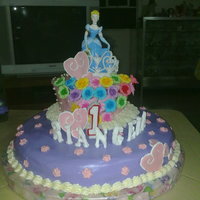 1St Birthday Cake Chocolate Cake with white chocolate buttercream frosting and white chocolate clay/paste... letters and heart made out of royal icing.