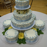 Wedding Cake With 6 Satellites 3 tiered wedding cake with 6 satellite cakes.
