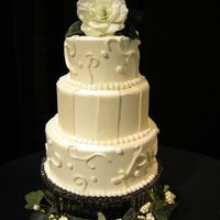 Fondant Accents These are 12", 10", and 8" styrofoam dummies for a wedding show. the cakes are covered in buttercream frosting and accented...