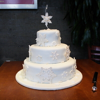 Winter Wedding This cake features handmade and pre-made snowflakes on a clean ivory background. Fondant cakes, pastillage snowflakes with royal icing...