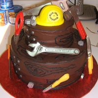 Rob The Builder Cake for my neighbor who we jokingly call "Rob The Builder". Tools are molded chocolate painted with silver luster dust. Hardhat...