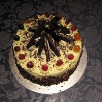 Black Forest Cake Made in class, black forest cake with sour cherry filling. Made the chocolate cigars and curls.