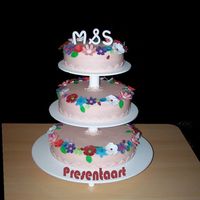 Pale Pink Wedding Cake With Flowers Cake is covered with marzipan, flowers are made of fondant.