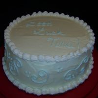 Good Luck 9" White on White Buttermilk cake with a white chocolate buttercream icing. For a co-worker.