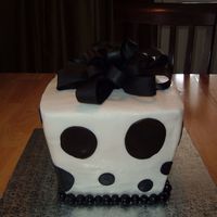 Present.jpg I was really nervous doing this cake. I HATE carving and just knew I was going to mess this up. Icing it was fun either. But the wedding...