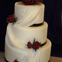 Ribbon, Drapes And Roses Dummy cake that I mde for my open house. I was SO pleased with the outcome! :) satin ribbon, silk roses. iw as going to use gumpaste, but...