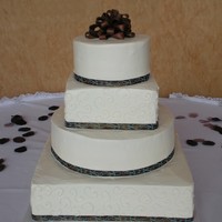 Round/square Wedding Cake Alternating round and square with ribbon around the bases. Bow was made from fondant. As we were leaving the venue, we saw the photographer...