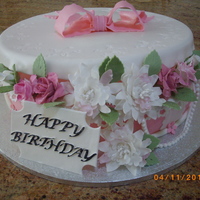 My Grandmother 90Th Birthday Cake My this cake for my grandmother on her 90th birthday cake. Flowers are made out of gum paste, covered in fondant, cake was red velvet....