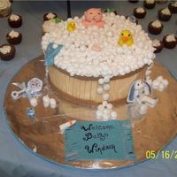 Baby In The Tub I made this for a friends baby shower. I made the top seperate from the cake so it could be taken off to save. Thanks for looking.
