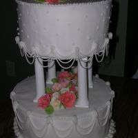 Wilton Course 3- Fondant Tiered Cake this is actually a tiered cake made out of 8" and 10" cake dummies, covered in BC to hold down Fondant and then decorated with BC...