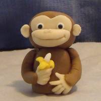 Curious George George is made from fondant. My favorite part is the little banana in his hand :) The bananas are "Runtz" and I painted the ends...
