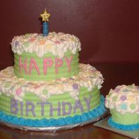 First Birthday And Smash Cake 6 and 10 inch dark chocolate cakes. All buttercream decorations. The smash cake was made with a large muffin tin. Inspired by a Wilton...