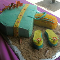 Beach The beach bag,towl and flip flops are cake in b/c, the lai is made out of gumpaste flowers,was fun to make.
