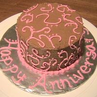Anniversary Cake Two 4" chocolate cakes with chocolate buttercream. This was the first time to try scroll work--I think it turned out pretty good.