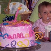 Large Squiggly 1St Birthday Cake This cake is a buttercream creation with royal icing pieces.