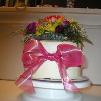 Cake With Fresh Flowers I topped the cake with floral foam w/ wax paper under it, so it wouldn't touch the cake and anchored it w/ skewers as well. I did put...