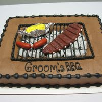 Bbq Grill This cake was something else! It's a chocolate cake with chocolate buttercream icing and fondant accents.