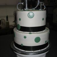 Polka Dots I made this cake for a small wedding. I also made the topper. This is a chocolate cake with chocolate fudge filling iced in buttercream....