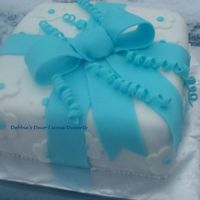 Blue Bow Cake Yellow cake, strawberry filling, fondant coverings. This cake was a gift to a little boy who has cancer, and his family.