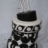 Black And White All fondant decoration. The "N" is made out of modeling paste. I made it for my husbands birthday