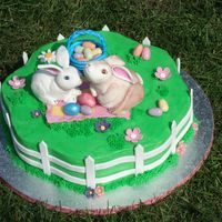 Bunny's Picknick The bunnies are made out of modeling paste, the fence and eggs out of gumpaste. Flowers are fondant