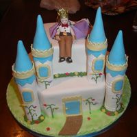 Castle And Prince Birthday cake for a boy who wanted a prince on his cake. The castle turrents are made from pastillage. The cake is covered with fondant,...