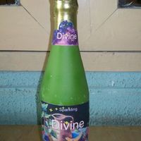 Wine Bottle This bottle was made from pastillage. I used two bottles of wine of same type to model this. It is hollow. I printed out a label(not edible...