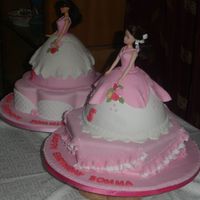 Sommie & Somma This cakes were made for two friends who share birthdays. They insisted on having doll cakes. The covering and decorations are fondant