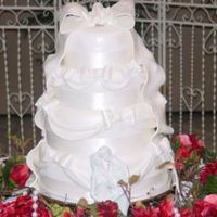 Bows & Swags Firwst wedding cake. All fondant bows and swags.