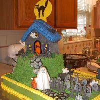 Halloween/haunted House This was a Halloween/50th birthday cake that I did for for my sister's surprise 50th birthday party. 1/2 sheet cake with rounds for...