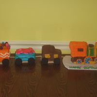 Henry's 2Nd Birthday I made this for my little boy's second birthday today. It's all yellow cake, buttercream icing. In the train cars are Laffy Taffy...