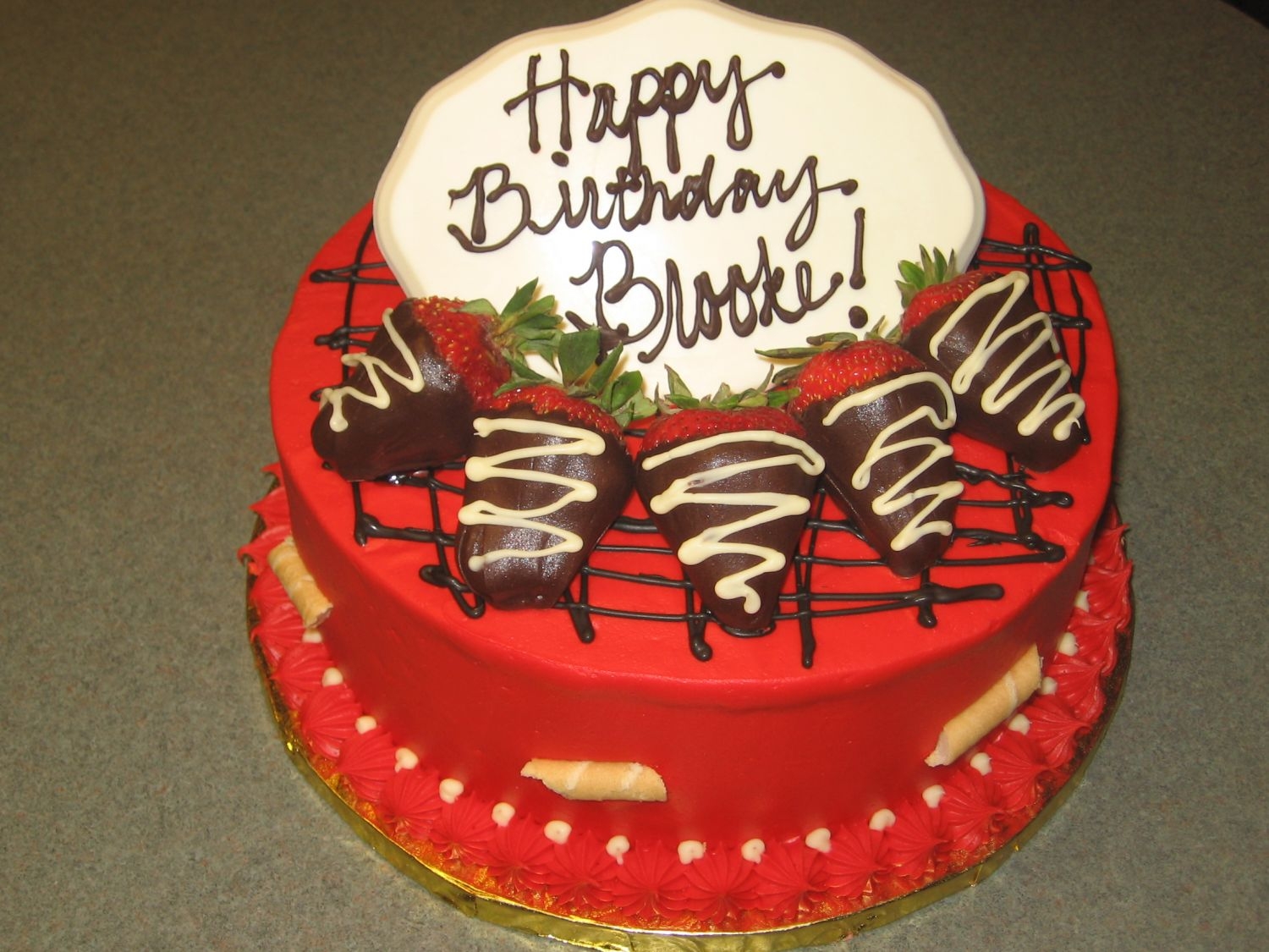 Red Birthday Cake 10" round red velvet cake with cream cheese icing, melted chocolate lines on top, chocolate dipped strawberries, and a white chocolate...