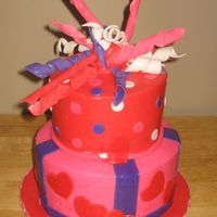 Valentine's Day Cake I did this for a youth group's Valentine's party. 8" and 6" yellow cakes with cream cheese icing and filling, MMF...