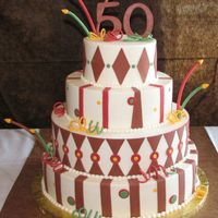 Fun 50Th For A Man This cake is iced in buttercream with fondant accents. The 50 on top, curlies and candles are all fondant with Tylose added.