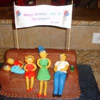 Simpsons Joel's Birthday vanilla cake with chocolate butter cream frosting. Decorations are made of fondant
