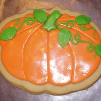 Pumpkin Cookie My sister wanted cookies for her birthday, so we all got together and designed our own pumpkins. This one was mine.