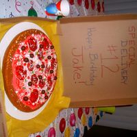 Pizza Cake CAKE WITH RED BUTTERCREAM FOR "SAUCE" AND CANDIES FOR THE "TOPPINGS"