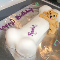 Dog Bone Cake Pumpkin roll cake, fondant dog.