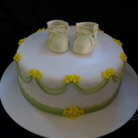 Baby Shower Covered in Fondant with fondant decorations and gumpaste booties.