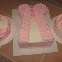 Baby Shower, Dress, Bonnet, And Booties All buttercream, except for dress, bonnet, booties and flowers made out of gumpaste.