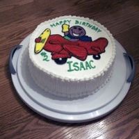 A Barney Birthday 9-inch round, 2-layer; picture transferred using rice paper.