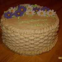 Sany8771Smaller.jpg The basketweave was done with tip 18. Fondant daisies.
